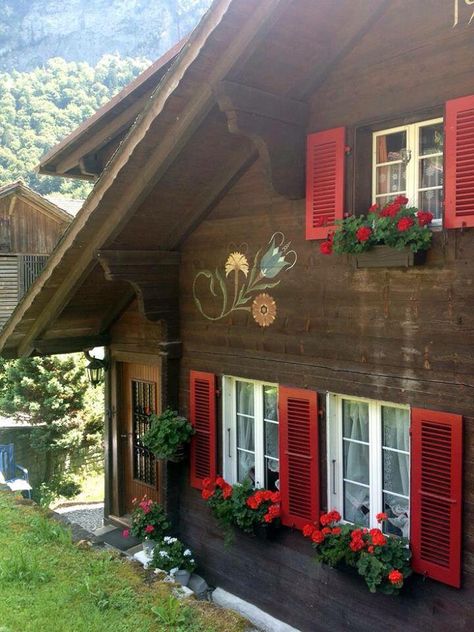 Saved Photo ￼ Brown House Green Shutters, Brown House Red Trim, Heidi House Switzerland, Brown House With Shutters, Swiss Cabin Chalet Style, Switzerland House Cottages, Bavarian Cabin, Chalet Windows, Bavarian Cottage