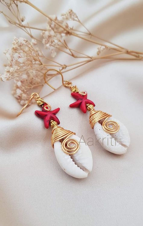 Beach Shell Earrings Made Of Cowrie, Unique Handmade Shell Earrings, Summer Shell-shaped Earrings With Ear Wire, Beach-style Cowrie Shell Earrings, Handmade Shell-shaped Beachy Earrings, Jewelry Packaging Design, African Inspired Jewelry, Cowrie Shell Jewelry, Diy Wire Earrings