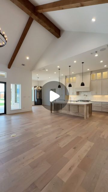 Carrasco Homes on Instagram: "Imagine coming home to this #kitchen 😳 stunning interior design and home layout by yours truly, in #midlandtx. We love this elongated kitchen island, custom fixtures, and beige tones. It’s giving warm, contemporary - which seems to be the theme for #homedesign2024. Build with us 👇   📱: (432) 553-6344 📧: carrascohomesllc@sbcglobal.net" High Ceiling Kitchen Design, Celling Design Kitchen, High Ceiling Kitchen, Kitchen Layout With Island, Open Kitchen Layout, Vaulted Ceiling Kitchen, Kitchen Layouts With Island, Home Layout, Stunning Interior Design