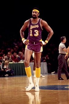 Wilt Chamberlain #13 of the Los Angeles Lakers walks the court during a game played against Milwaukee Bucks in 1972 at the Mecca in Milwaukee, Wisconsin. Wilt Chamberlain, Sporting Legends, Lakers Basketball, Nba Logo, Nba Legends, Nba Stars, Sports Hero, Basketball Legends, Milwaukee Wisconsin