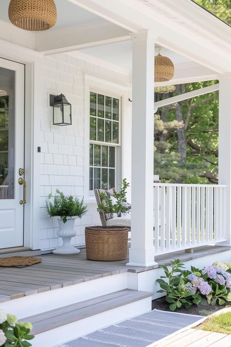 Transform Your Porch: 12 Coastal Design Tips for a Summer Oasis - Casually Coastal Hampton Style Verandahs, Porch Colors For White House, White House With Hydrangeas, Cape Cod Front Porch Ideas, Front Porch White House, White House Front Porch, White House With Porch, White Farmhouse Porch, Cottage Front Porch Ideas