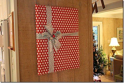 Present Wall Decor Christmas, Wrapping Paper Pictures Wall Art, Wrap Pictures On Wall Christmas, Picture Wrapped As A Present On Wall, Christmas Wrapped Pictures On Wall, Wrapping Paper On Walls Christmas, Wrapping Wall Art For Christmas, Decorating With Wrapping Paper, Wrapping Pictures On Wall Christmas