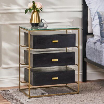 Highlight your interior space with streamlined style and delightful storage space to bring your home décor to the next level. With a chic brass frame and three sleek drawers, our nightstand offers incredible structure to organize your items with ease. This handcrafted nightstand is topped with a beautiful glass top, bringing stunning looks to your interior space. Blending seamlessly with your existing décor, this nightstand will frame your bed with a luxurious and modern charm, making this the p Handcrafted Nightstand, Brass Nightstand, Metal Nightstand, 3 Drawer Nightstand, Wooden Drawers, Random Ideas, Noble House, Christopher Knight Home, Wood Drawers