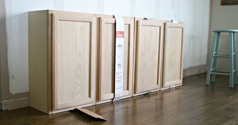 How to use affordable, unfinished kitchen cabinets to create built in storage and bookcases. Home Depot Cabinets, Unfinished Kitchen Cabinets, Unfinished Cabinets, Stock Kitchen Cabinets, Small Bedroom Remodel, Office Built Ins, Built In Shelves Living Room, Living Room Built Ins, Thrifty Decor Chick