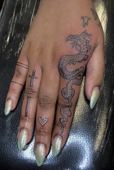 Dragon Drawing On Hand, Dragon Tattoo On Hand For Women, Hand Tattoos For Women Dragon, Dragon Hand Tattoos For Women, Dragon On Finger Tattoo, Finger Tattoos Dragon, Finger Tattoos On Black Women, Dragon Tattoo For Women Hand, Finger Dragon Tattoo