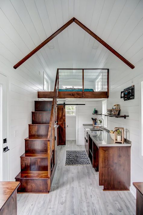 Inside the tiny home are poplar walls and vinyl flooring for easy maintenance. The stained wood finishes add vibrant color against the white walls and light gray flooring. Upcycled Kitchen, Tiny House Interior Design, Tiny House Loft, House Loft, Best Tiny House, Tiny House Inspiration, Modern Tiny House, Tiny House Decor, Tiny House Interior