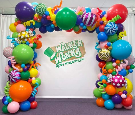 Organic Balloon Decor - Willy Wonka Balloon Arch with Mylar Candy Balloons & Custom Logo Backdrop - creative party design idea - We can create organic balloon arches, columns, balloon walls & even ceiling decor. Organic balloons are a fun way to add color and vibrancy to any event. Logo Backdrop, Chocolate Factory Party, Willy Wonka Party, Candy Balloons, Deco Ballon, Candy Birthday Party, Candyland Birthday, Balloon Arches, Lollipop Candy