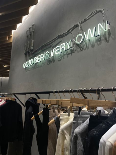 clothing garment rack at the ovo store by drake with a neon sign that reads October’s very own at the grove mall in Los Angeles Ovo Store, The Grove, Drake, Angeles, Angel, Quick Saves, Los Angeles