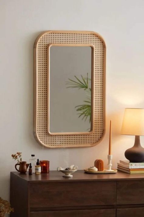 This extraordinary mirror, crafted entirely from real wood, brings captivating elegance to your decor with its durable natural wood frame. Reflecting the mastery of craftsmanship, this mirror stands out with the use of premium-grade materials that elevate its quality. The 4mm fade-resistant glass surface ensures a lasting brilliance, while the wooden frame emanates the warmth of nature, creating a unique character for your space. Mirrors Urban Outfitters, Cane Decor, Boho Apartment, Mirror Decor Ideas, Wardrobe Door Designs, Apartment Decoration, Cane Furniture, Rattan Mirror, Wooden Mirror