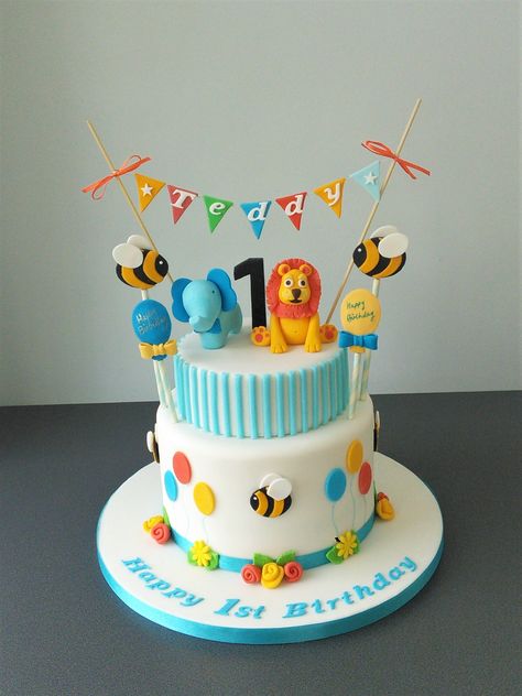 1st birthday cake with animals, bees, balloons and bunting Cake Design For 1st Birthday Boy, Bees Balloons, Cake Designs For Baby Boy, Baby Boy Birthday Cake 1 Year, Cake With Animals, First Birthday Cake Boy, Baby Boy First Birthday Cake, 1st Birthday Cake Designs, Cake Designs For Boy