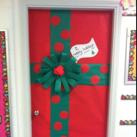 Gift wrapped door  #preschool #prek #bulletinboards #winter #classroomdoor #christmas Easy Door Decorations Classroom Holidays, Christmas Gift Door Decoration, Present Door Decoration Christmas, Gift Wrap Door Decoration, Simple Christmas Door Decorating Contest, Christmas Present Door Decoration, Door Present Decoration, Simple Christmas Door Decor, Gift Wrapped Door