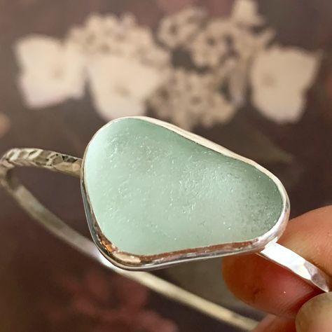 ~ In love with this glow!! ✨ ~ Another beautiful custom bangle with sea-foam sea-glass 😍 ~ Each bangle is made to order to make sure you get the exact size you need, and the exact shade of sea-glass I use too 🩵 ~ These can also be made with your own sea-glass, just send me a message 💌 Sea Glass Rings Sterling Silver, Sea Glass Bangle, Silver Sea Glass Jewelry For Beach, Adjustable Silver Ring With Sea Glass, Custom Bangle, Hand-wrapped Sea Glass Jewelry For The Beach, Sea Glass Bracelet, Glass Bangles, Stacked Bangles