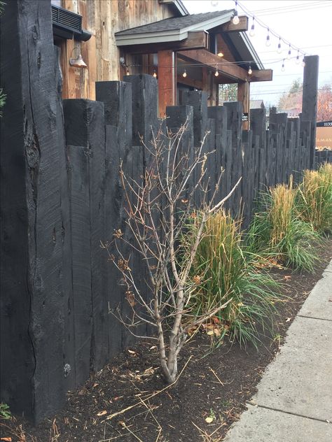 Creative way to use railroad ties. End Of Driveway Fence Ideas, Railroad Tie Fence Post, Telephone Pole Fence Ideas, Railroad Tie Fence Ideas, Railway Ties Landscaping, Railroad Ties Landscaping Flower Beds, Railroad Ties Fence Ideas, Railway Sleeper Fence, Railroad Ties Fence