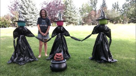 Do you like decorating for Halloween but don't want to break the bank doing it? I'm sharing how to make yard witches on a budget! You can see more of my crazy creations here I started with a regular sized tomato cage and placed it upside down on the floor. I put a plastic pumpkin pail upside down onto the 3 stakes of the tomato cage. Depending on the weather and where you're putting them you can use twine to tie the pumpkin pail handle to the tomato cage for stability. I placed a… Yard Witch, Fall Plaid Decor, Diy Witches, Hermanas Sanderson, Witches Garden, Decorating For Halloween, Topiary Diy, Pumpkin Pail, Elegant Pumpkins