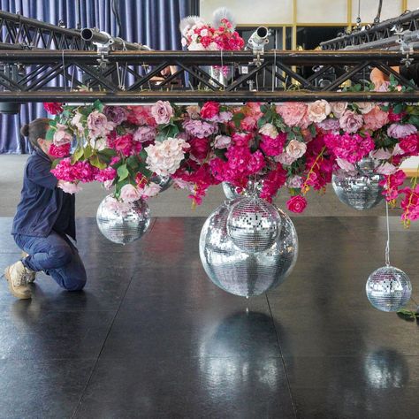 Throwback to this epic floral disco ceiling installation at @luminare.southmelbourne These vibrant florals were taken to the next level with the addition of some shimmering silver mirror balls. The perfect dance floor feature for guests to boogie the night away underneath! Venue @luminare.southmelbourne #corporateevents #disco #floraldisco #pinkdisco #floralinstallation #melbourneevents Disco Ceiling, Flowers And Disco Balls, Vibrant Florals, Ceiling Installation, Mirror Ball, Disco Balls, Hanging Flowers, Silver Mirror, Ceiling Decor