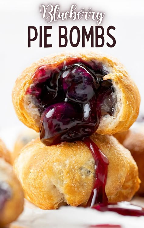 Close up image of two pie bombs stacked on top of each other. The top pie bomb has been cut open to showcase the blueberry pie filling that is inside. Frozen Blueberry Pie, Raspberry Pie Filling, Homemade Blueberry Pie, Blueberry Desserts Recipes, Peach Pie Filling, Pillsbury Recipes, Blueberry Pie Filling, I Am Baker, Blueberry Desserts