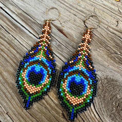 Life has been chaotic lately…but surviving chaos is what we all do on a daily basis! Sitting at my desk in my craft room calms me when life feels too chaotic! These peacock feather earrings remind me of when my children were small and we lived on a small ranch that housed many peacocks. My children would sell peacock feathers so they could have a treat of pizza and a movie…I’m fond of these memories! I will soon be listing these earrings in my Etsy shop! . . . #earrings #beadedearrings #... Beading Earring, Peacock Feather Earrings, Brick Stitch Earrings, Beaded Earrings Patterns, Ear Candy, Peacock Feathers, August 1, Instagram Life, Peacock Feather