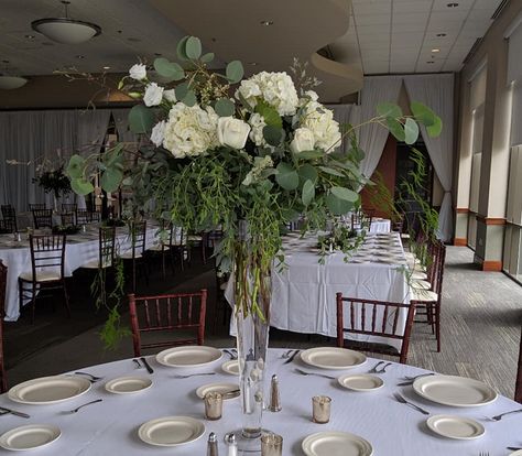 Tall Pilsner arrangement with hydrangea and eucalyptus Tall Centerpiece, Tall Centerpieces, Pilsner, Hydrangea, Special Day, Table Settings, Table Decorations