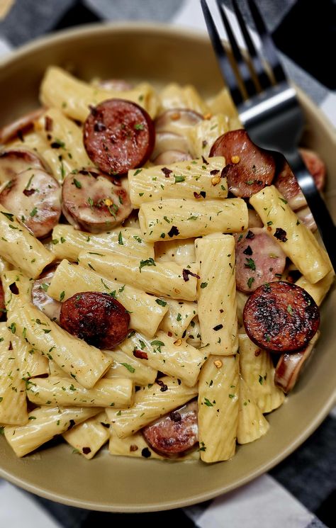 Smoked Sausage & Mozzarella Pasta - A very simple weeknight supper loaded with smoked sausage, rigatoni pasta and a creamy mozzarella sauce. Easy Dinner Smoked Sausage, Noodle Sausage Recipe, Andouille Smoked Sausage Recipes, Smoked Sausage Noodle Recipes, Dinner Recipes With Sausage Links, Recipes With Ring Sausage, One Pot Kielbasa Recipes, Brat Pasta Recipe, Chicken And Sausage Recipes Dinners