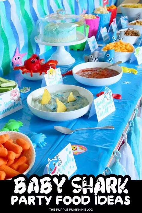 Hungry little sharks at your party? Don't worry, we've got you covered with these Baby Shark party food ideas. From shark bite sandwiches to fish-shaped cookies, these tasty treats will keep everyone happily swimming along. Find all the awesome Baby Shark party ideas on The Purple Pumpkin Blog! Shark Snacks For Birthday, 3rd Birthday Party Sharks, Shark Themed Appetizers, Baby Shark Birthday Party Girl 3 Year, Shark Themed Birthday Party Food, Baby Shark Birthday Party Girl Food, Baby Shark Party Games, Baby Shark Snack Ideas, Baby Shark Birthday Food Ideas