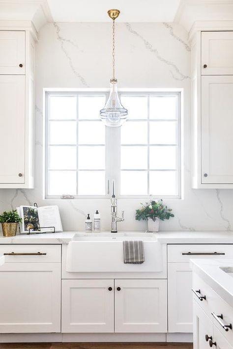 White Kitchen With Window Over Sink, Backsplash Around Window Kitchen, Quartz Kitchen Backsplash, Backsplash Around Kitchen Window, Kitchen Slab Backsplash, Quartz Slab Backsplash, Slab Backsplash Kitchen, Quartz Backsplash Kitchen, Lighting Over Sink