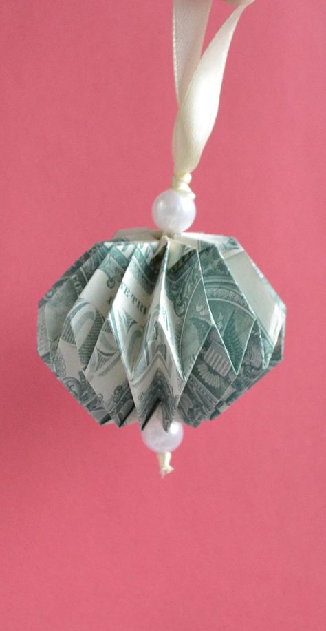 The money toy (ball) is an easy origami for your Christmas tree. We need two dollar bills, a satin ribbon, beads. Without glue or tape. The idea and design by Anastasia Prokuda. I wish you a pleasant viewing! Subscribe to my channel! Money Ornaments Diy, Money Tie How To Make A, Folded Dollar Bills Easy, Origami Using Money, Money Christmas Tree, Money Ornaments, Dollar Folding, Money Wreath, Money Angel