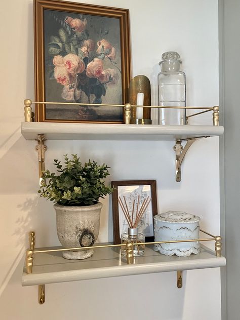 French Decor Aesthetic, French Guest Bathroom, French Inspired Bathroom Decor, Gallery Shelves Living Room, Vintage Bathroom Organization, Adding Antiques To Modern Home, Bathroom Inspiration Vintage, Shelves With Gallery Rails, Bridgerton Bathroom