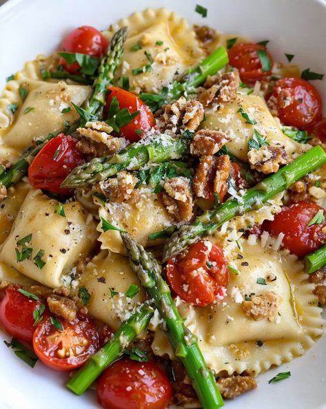 Savor the taste of spring with this easy Ravioli recipe topped with fresh tomatoes, asparagus, garlic, and herbs! A quick, flavorful dinner delight. #RavioliRecipe #SpringPasta #EasyMeals #ItalianCuisine #VegetarianDelight Cheese Ravioli With Asparagus, Veggie Ravioli Recipe, Ravioli With Tomatoes Asparagus Garlic, Ravioli With Tomatoes And Asparagus, Best Ravioli Recipe, Easy Ravioli Recipe, Ravioli With Asparagus, Spaghetti Dishes, Easy Ravioli