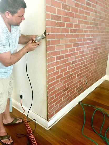 My husband and I love the look of exposed brick look. Unfortunately, our house was built-in 1954 and lacks of all those cool features some older homes and industrial lofts have.We have worked very hard trying to give this 1950’s ranch style home some character. Today, I would like to share with you this faux brick wall I did a few months ago. This is one of my favorites projects I have done in our house so far. My first step was to run to Home depot to buy the 4′ x 8′ brick… Fake Brick Wall, Brick Wall Living Room, Faux Brick Wall Panels, Fake Brick, Faux Brick Wall, Industrial Lofts, Brick Wall Paneling, Faux Brick Panels, Older Homes