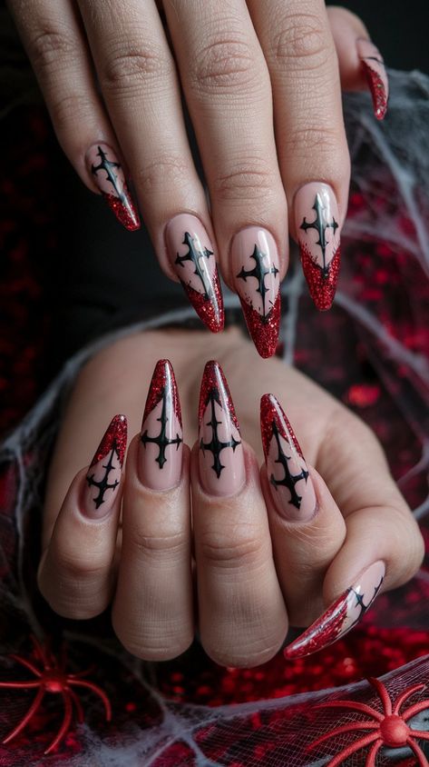 Embrace your dark side with these gothic-inspired stiletto nails! The nude base elegantly frames a striking black cross design that fans out, while vibrant red glitter at the tips adds a captivating touch. Set against a vampy red velvet backdrop with spider web accents, these nails are perfect for Halloween or any occasion when you want to make a bold statement!
#halloweennails #halloweenvibe #halloweeninspo #acrylicnails #nailsdesign #octobernails Dark Red Nails Halloween, Goth Stiletto Nails Designs, Spiderweb Nails Coffin, Press On Nails Goth, Gothic Cross Nails, Gothic Holiday Nails, Ruby Gloom Nails, Winter Goth Nails, Gothic Fall Nails