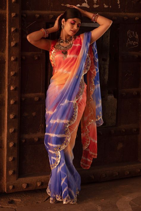 Royal blue and orange leheriya saree in chiffon base fabric with hand embroidered sequins cutwork hemComes with blouse. Component2 PatternEmbroidered Type Of WorkSequins Sleeve TypeSleeveless FabricPure Chiffon ColorBlueOrange Other Details Scalloped hem saree Leheriya work Sequins hand embroidery OccasionWeddingAza Fashions Royal Blue And Orange, Leheriya Saree, Black Color Hairstyles, Mom Daughter Outfits, Color Hairstyles, Plain Saree, Indian Fashion Saree, Sequin Sleeve, Pure Chiffon