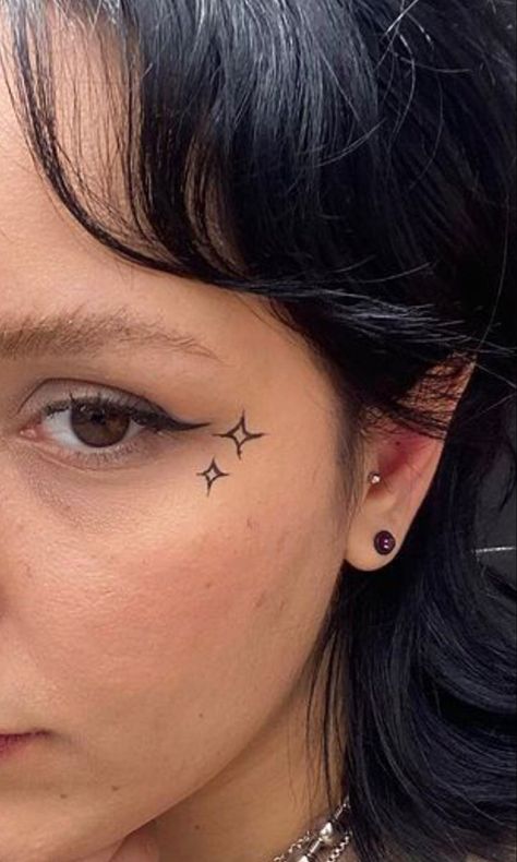 Sagittarius Face Tattoo, Small Cheek Tattoo, Sparkle Face Tattoo, Nose Tattoo Ideas, Tiny Face Tattoos For Women, Red Face Tattoo, Number One Tattoo, Cute Face Tattoos, Cheek Tattoo