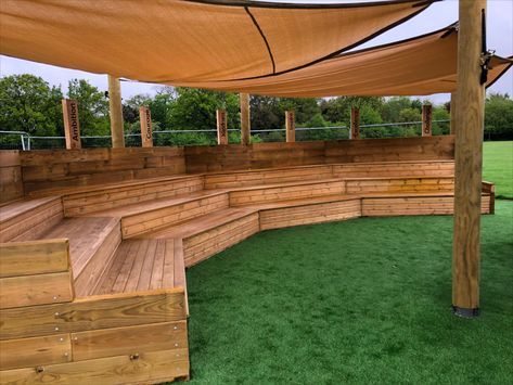 Bespoke outdoor classroom amphitheatre which has a seating area for 60 children with a covered sail to provide for sun and rain shade and with a special enclosed stage and performance area.

This outdoor classroom ampitheatre is the perfect idea for your elementary or preschool to provide a learning area for education outside. Outside Learning Area, Outdoor Classroom Seating, School Courtyard Ideas, Mini Amphitheatre, Amphiteather Outdoor, Outdoor Amphitheatre, Outdoor Auditorium, Outside Classroom, Outdoor School Seating