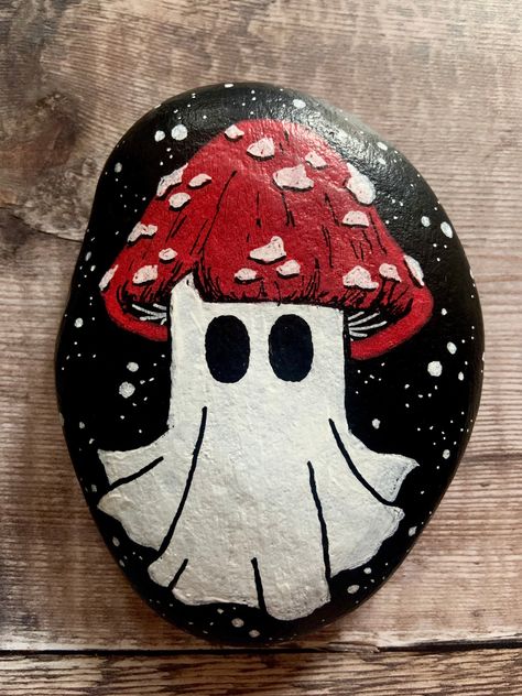 This is a hand painted pebble by A Forest of Shadows!  🍄Featuring a cute kawaii mushroom ghost! 👻Hand painted in acrylics and finished with varnish. 🍄Perfect as a paperweight, or to add some spooky decor all year round. 👻Measures approx 12cm X 9cm. Please have a look at my other work at www.Etsy.com/shop/aforestofshadows Cute Painted Pumpkin Ideas, Mushroom Ghost, Pumpkin Painting Party, Art Mini Toile, Halloween Pumpkin Crafts, Creative Pumpkin Painting, Amanita Mushroom, Mushroom Paint, Hallowen Ideas