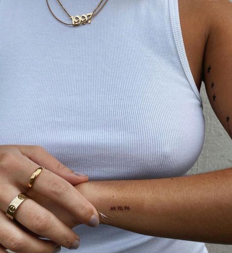 Jessica Olie Tattoo, Fine Line Roman Numeral Tattoo Arm, Fred Again Tattoo Ideas, Tiny Side Tattoo, Small Inner Elbow Tattoo, Small Metal Health Tattoos, 714 Tattoo, Small Tattoo Inspo Women, Minimalist Initial Tattoo