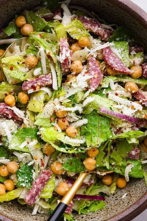 Fresh and flavorful, La Scala Salad is a copycat recipe of the famous Italian chopped salad served at La Scala restaurant in Beverly Hills. Rumor has it, Kim Kardashian orders this salad often, and for good reason! It's packed with delicious ingredients and crunchy texture, thanks to the chickpeas, salami, mozzarella cheese, and a zesty red wine vinaigrette. La Scala Bean Salad, Orso Salad Recipes, Lettuce Pasta Salad, Cpk Salad, Kardashian Salad Recipe, Ceaser Salad Ideas, Salad Recipe With Chickpeas, La Scala Salad, Kardashian Salad