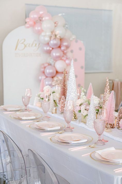 Step into a winter wonderland fit for a little princess! 🎀❄ Our 'Baby, It's Cold Outside' themed baby shower for a baby girl is a dream come true. Imagine pink Christmas trees glistening in faux snow, surrounded by fresh florals that add a touch of elegance. Our event is a vision of loveliness, with larger-than-life pink Christmas trees and enchanting balloon backdrops that set the stage for a magical celebration. Elegant Winter Wonderland Party, Pink Christmas 1st Birthday, Pink Baby Shower Winter, Baby Its Cold Outside Baby Shower Ideas For Girl, Pink Winter Wonderland 1st Birthday, Winter Wonderland Pink Baby Shower Ideas, Pink Winter Wonderland Party Decorations, Sweet One Christmas Birthday, Winter Pink Baby Shower Ideas