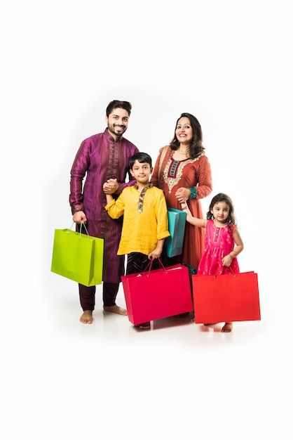 Indian family celebrating diwali or deep... | Premium Photo #Freepik #photo #indian-parents #indian-family #asian-family #family-shopping Family Celebrating Diwali, Family Cloth, Iphone Red Wallpaper, Shop Banner Design, Flex Banner Design, Diwali Poster, Diwali Photos, Family Festival, Whatsapp Profile Picture