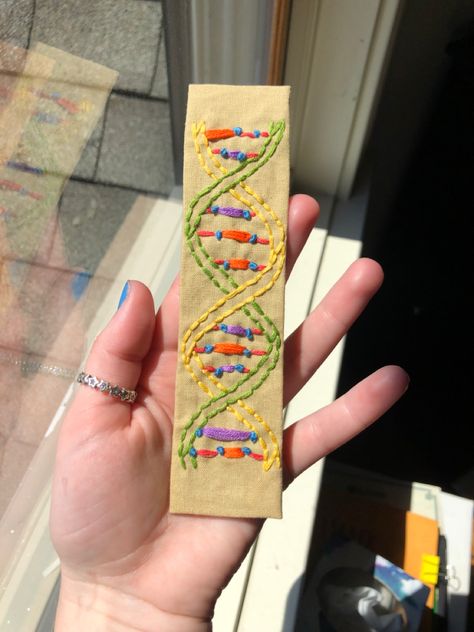 Embroidered dna bookmark Science Bookmarks, Bookmark For Biology, Biology Bookmark, Water Bottle Crafts, Microbiology, Embroidery Craft, Bottle Crafts, Biology, Embroidery