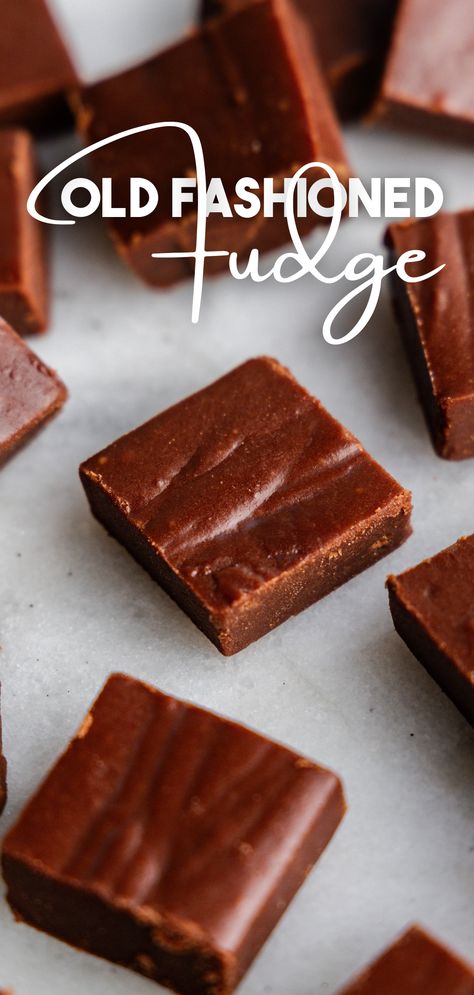 A close up of scattered squares of fudge on a marble surface. Old Fashioned Cocoa Fudge, Fruit Fudge Recipes, Best Creamy Fudge Recipe, Fansty Fudge, Old Fashion Fudge Recipes Grandmothers, Classic Fudge Recipes, Old Time Fudge Recipe, Old Fashioned Fudge Recipe, Crumbly Fudge Recipe