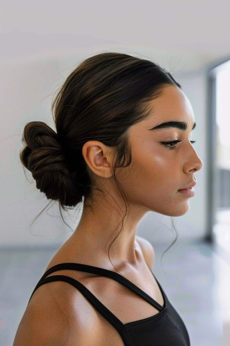 Gym-ready low bun for active lifestyles. Active Updos, Cute Workout Hairstyles For Short Hair, Sporty Updos, Gym Updos, Crossfit Hairstyles, Easy Gym Hairstyles, Gym Hairstyles For Long Hair, Easy Workout Hairstyles, Ethiopian Hair