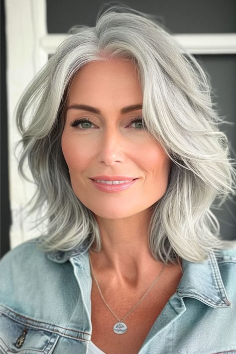 Shoulder-Length Layers Hairstyle for Women Over 50 with Thick Hair. Grey Shoulder Length Hair Over 50, Hairstyles For Thick Wavy Hair Over 50, Thick Gray Hair Over 50, Gray Hair Bangs Over 50, Medium Length Haircut For Thick Hair Long Layered, Shoulder Length Hair Grey, Short Hair Highlights And Lowlights Older Women, Medium Length Haircut Gray Hair, Shoulder Length Gray Hair With Bangs