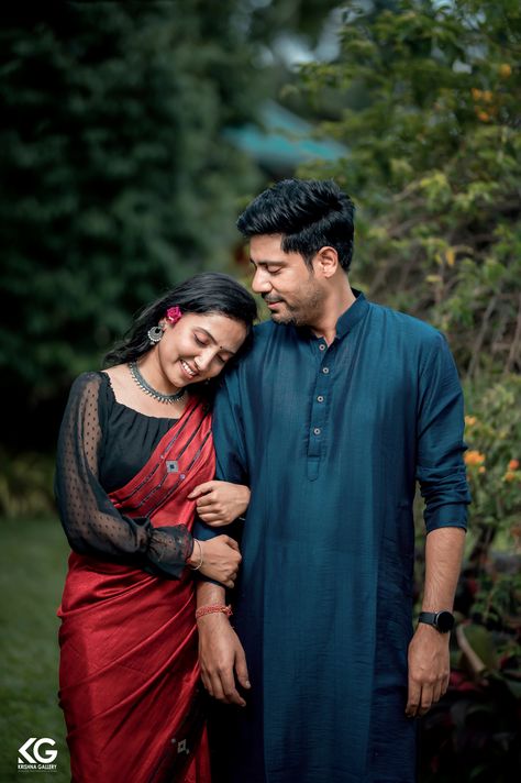 Romantic pre-wedding photoshoot outdoors featuring a couple in traditional attire - the bride in a saree and the groom in a kurta. They share a candid moment filled with love and joy, capturing the essence of their upcoming journey into marriage. Pre Wedding Poses Indian Saree, Couple Pose In Saree For Photoshoot, Pose In Kurta, Prewedding Photoshoot In Saree, Saree And Kurta Couple Photoshoot, Couple Pose In Saree And Kurta, Pose Saree, Pre Wedding Pose, Saree Kurta