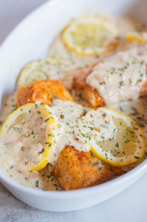 Oven Baked Salmon With Creamy Lemon Garlic Sauce Mahi Mahi Recipes Baked, Creamy Lemon Garlic Sauce, Baked Mahi Mahi, Easy Fish Dinners, Parmesan Crusted Salmon, Mahi Mahi Recipes, Lemon Garlic Sauce, Lemon Cream Sauces, Garlic Sauce Recipe