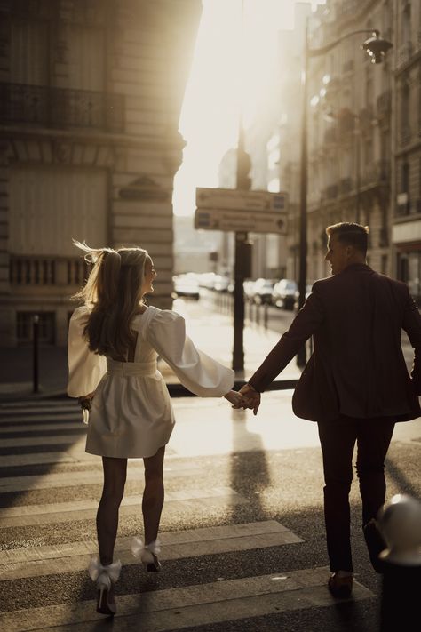 A couple holding hands during engagement shoot on the streets of Paris. Couple Shoot Poses Romantic Photo Ideas, Engagement Pictures Poses Romantic Photos, Couple Engagement Photoshoot, A Couple Holding Hands, New York Photoshoot, Best Engagement Photos, Paris Engagement Photos, City Couple, Creative Engagement Photo