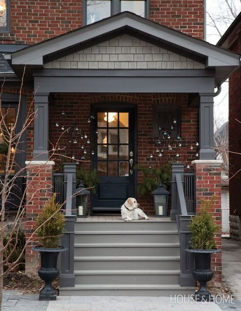 Branches adorned with silver and blue baubles add interest to this front porch. | Photographer: Donna Griffith | Designer: Ingrid Oomen Red Brick House Exterior, Red Brick Exteriors, Red Brick House, Front Porch Ideas Curb Appeal, Brick Exterior House, Front Steps, Exterior Paint Colors For House, Exterior Makeover, Exterior Remodel