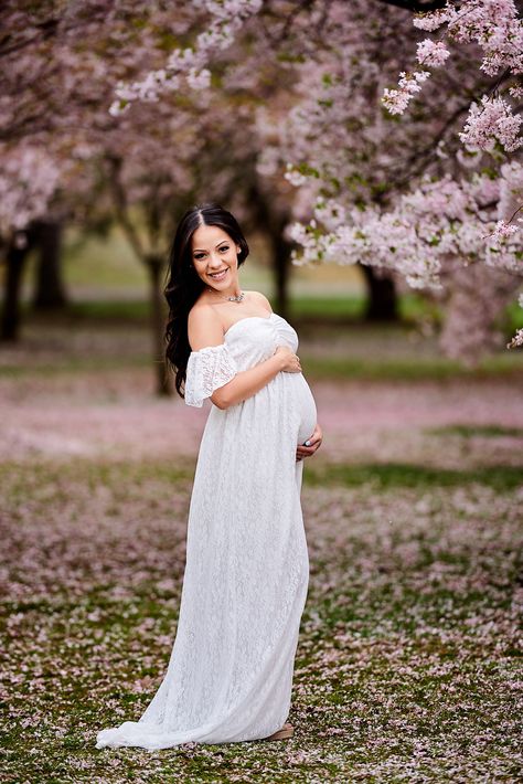 Maternity photo with Cherry Blossoms Newark NJ Maternity Cherry Blossom Photography, Maternity Photos Cherry Blossoms, Cherry Blossom Pregnancy Photos, Cherry Blossom Maternity Shoot, Spring Maternity Photos, Maternity Shoot Dresses, Couple Maternity Poses, Baby Announcement Photoshoot, Outdoor Maternity Photos