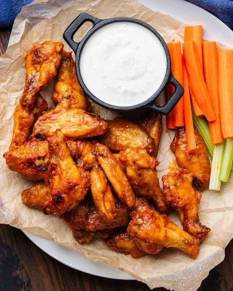 These homemade Buffalo Wings are the Best! Oven-baked and easy to make, these wings are prefectly sauced, crispy, and a must for any game-day or Superbowl gathering! Serve with homemade blue cheese dressing and you're all set! #buffalowings #hotwings #chickenwings Homemade Buffalo Wings, Best Buffalo Wings, Homemade Blue Cheese Dressing, Homemade Blue Cheese, Baked Buffalo Wings, Sip And Feast, Cayenne Pepper Sauce, Wings In The Oven, Wings Recipe Buffalo