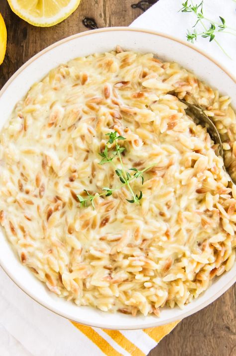 This Creamy Lemon Orzo is a simple and delicious side dish that can be ready in less than 30 minutes. Pairs perfectly with chicken or fish. Creamy Lemon Orzo, Homemade Baileys Irish Cream, 7 Layer Salad, Creamy Orzo, Homemade Baileys, Layer Salad, Risotto Dishes, Lemon Orzo, Make Ahead Salads