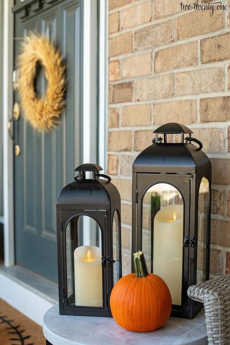 Decorating Ideas for a Warm and Cozy Fall Front Porch Fall Front Porch Lanterns, Large Lanterns On Front Porch, Fall Porch With Lanterns, Front Door Lantern Decor, No Rrom For Lanterns Front Entry, Outdoor Lanterns Front Door, Copper Lanterns Front Porch, Fall Open Lantern Decor Ideas, Lanterns On Front Porch